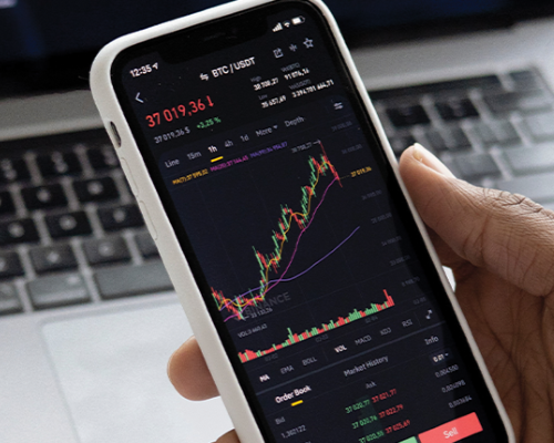 phone with stock markets charts